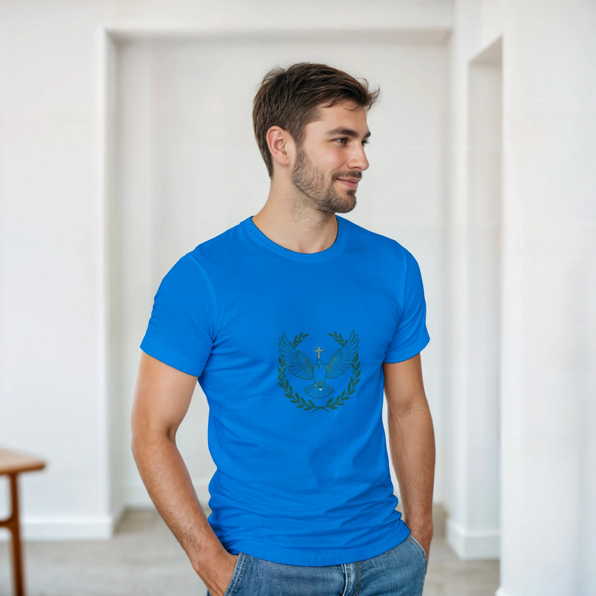 Blue t-shirt with a dove with wings spread inside an olive branch wreath below a cross