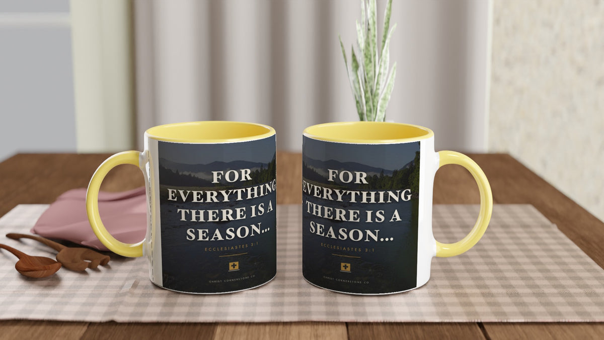Two Ecclesiastes 3:1 Scripture Ceramic Mugs with yellow interiors, shown together on a checkered kitchen table with a potted plant