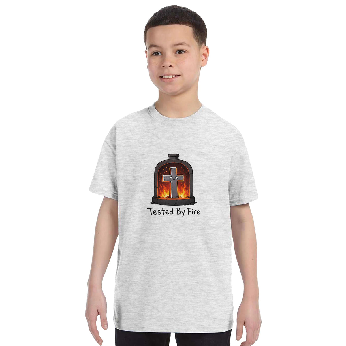 Grey heather Tested By Fire Kids Tee, worn by boy model, cross smiling in a fiery furnace