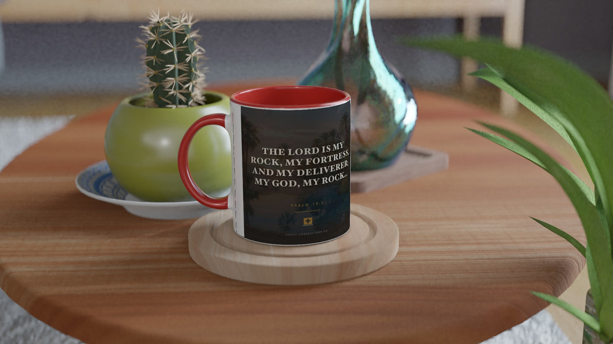 Psalm 18:2 ceramic mug with a blue interior and handle, on a side table with a cactus