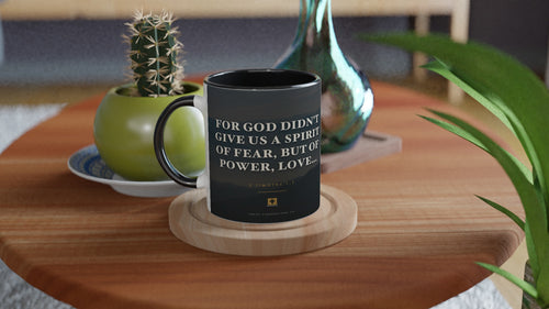 Black-handle 2 Timothy 1:7 mug, dusk mountain range photo design, styled with a cactus and vase